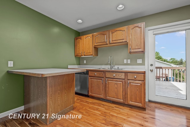 2364 Milford Dr, Saginaw, MI 48603 - kitchen featuring dishwasher, light countertops, light wood-style flooring, recessed lighting, and brown cabinets