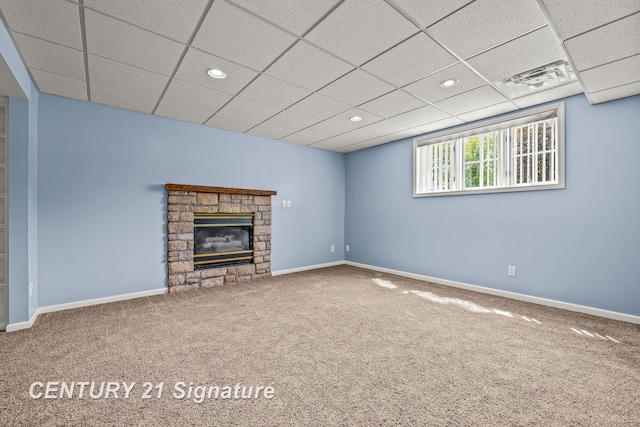 2364 Milford Dr, Saginaw, MI 48603 - unfurnished living room with carpet floors, recessed lighting, a stone fireplace, and a paneled ceiling