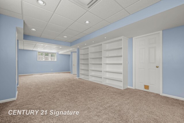 2364 Milford Dr, Saginaw, MI 48603 - basement with carpet flooring, a paneled ceiling, recessed lighting, and built in shelves