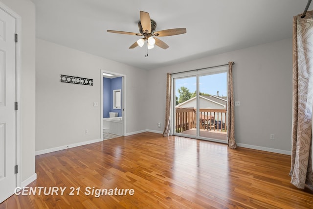 2364 Milford Dr, Saginaw, MI 48603 - empty room featuring a ceiling fan and wood finished floors