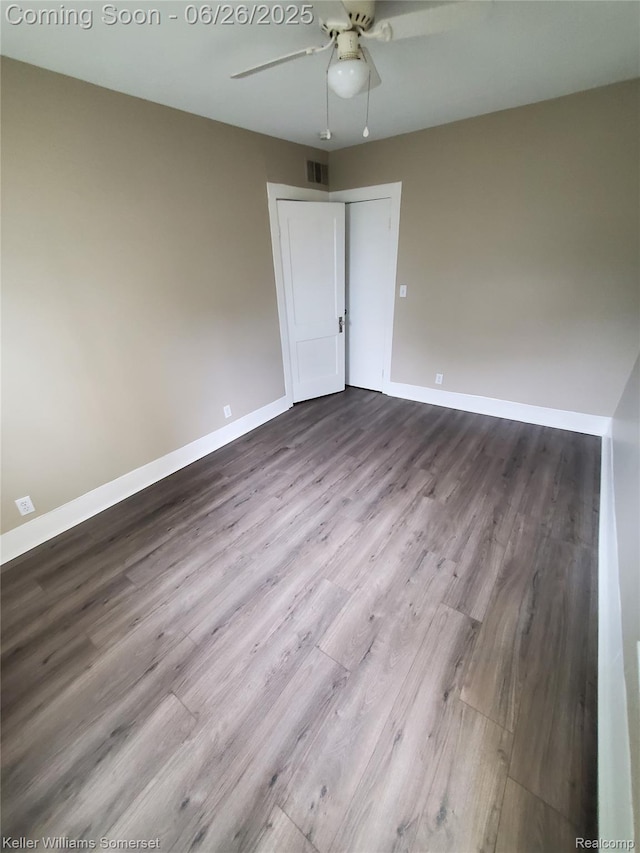 3909 Electric Ave, Port Huron, MI 48060 - spare room with dark wood-style floors and a ceiling fan