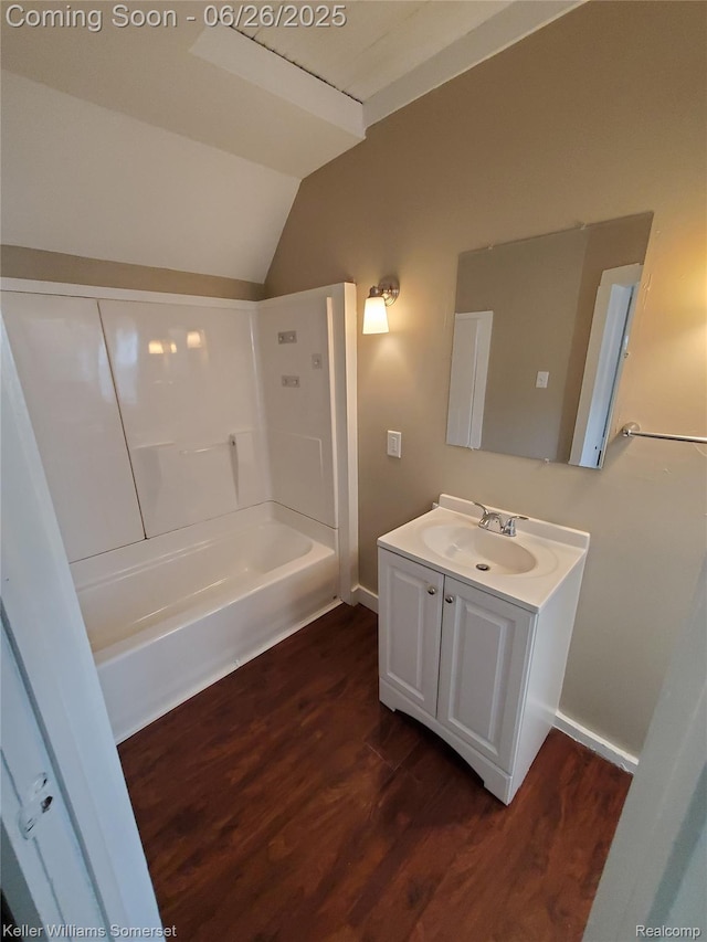 3909 Electric Ave, Port Huron, MI 48060 - bathroom featuring vaulted ceiling, vanity, wood finished floors, and shower / bath combination