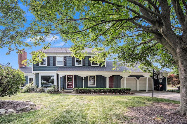 2104 Waterbury Dr SE, Kentwood, MI 49508 - traditional-style house featuring a front lawn, an attached garage, a porch, concrete driveway, and a chimney