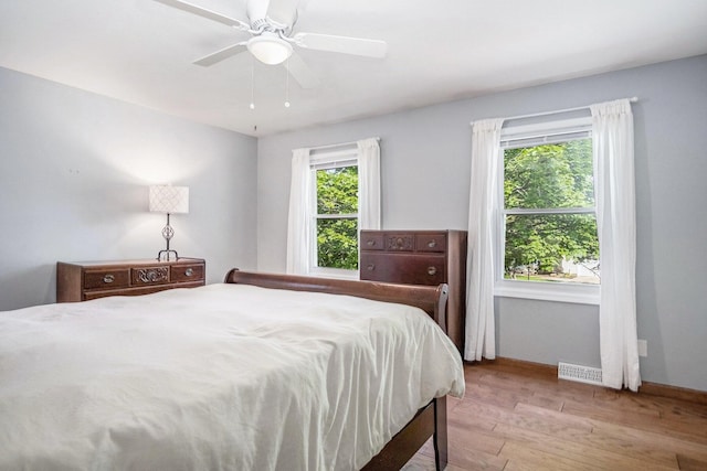 2104 Waterbury Dr SE, Kentwood, MI 49508 - bedroom featuring wood finished floors and ceiling fan