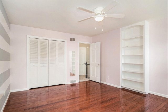 2104 Waterbury Dr SE, Kentwood, MI 49508 - unfurnished bedroom featuring wood finished floors, a closet, and ceiling fan