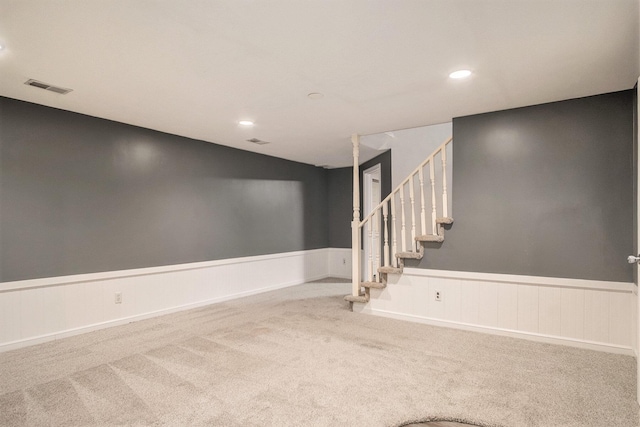 2104 Waterbury Dr SE, Kentwood, MI 49508 - carpeted empty room featuring wainscoting, stairs, and recessed lighting