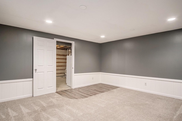 2104 Waterbury Dr SE, Kentwood, MI 49508 - carpeted empty room with wainscoting and recessed lighting