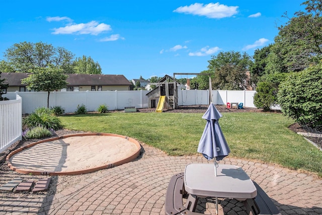 2104 Waterbury Dr SE, Kentwood, MI 49508 - fenced backyard with a playground and a patio