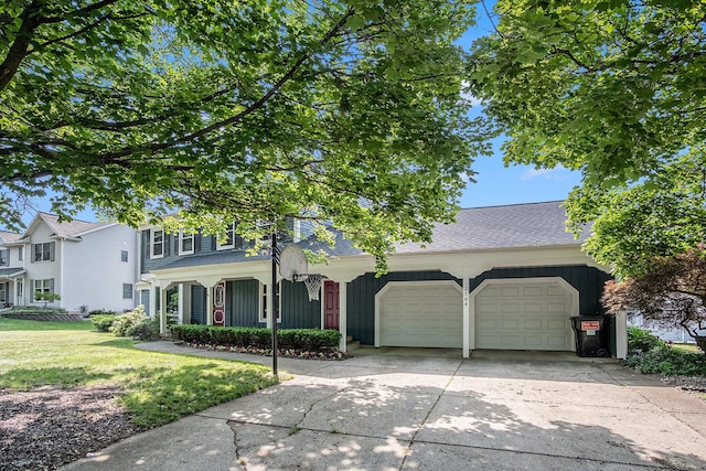 2104 Waterbury Dr SE, Kentwood, MI 49508 - view of front of property featuring an attached garage, driveway, a front lawn, and a shingled roof