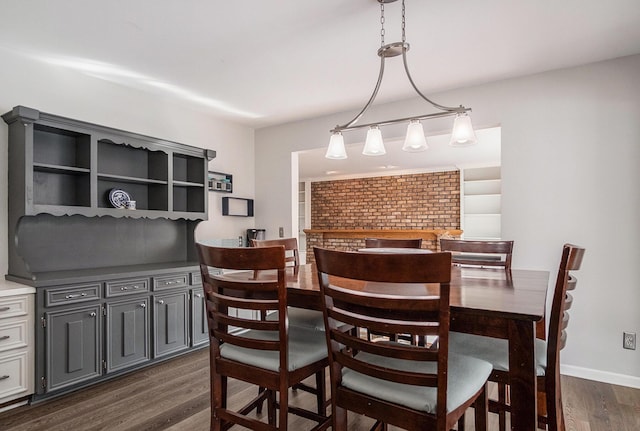 2104 Waterbury Dr SE, Kentwood, MI 49508 - dining area with dark wood-style floors and baseboards