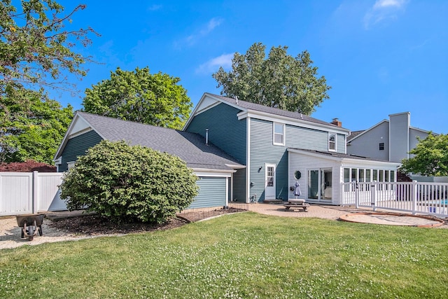 2104 Waterbury Dr SE, Kentwood, MI 49508 - rear view of house with a patio, a fire pit, a shingled roof, and a chimney