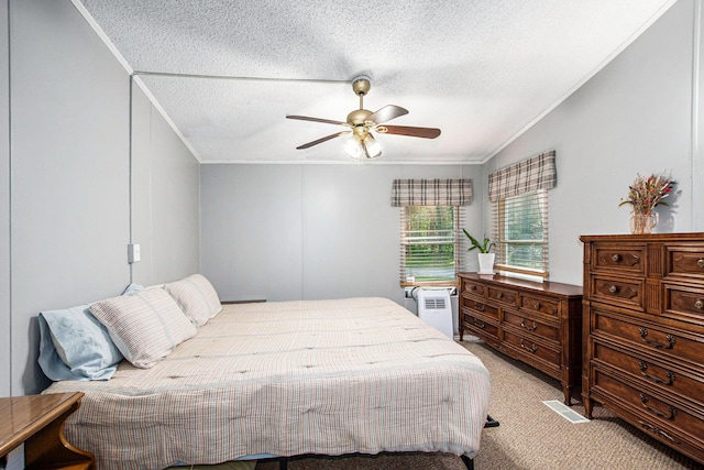 12467 S Running Deer Ln, Grant, MI 49327 - bedroom featuring crown molding, light carpet, a textured ceiling, a ceiling fan, and vaulted ceiling