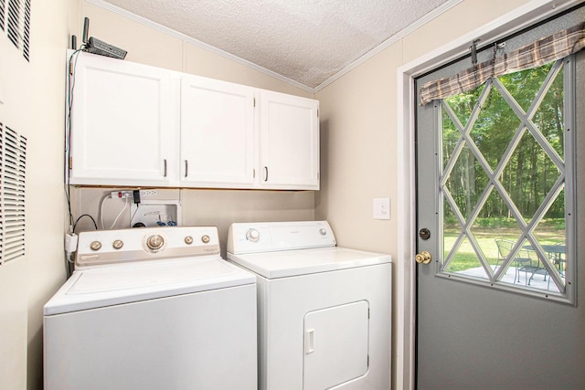 12467 S Running Deer Ln, Grant, MI 49327 - laundry area with cabinet space, washing machine and clothes dryer, crown molding, and a textured ceiling