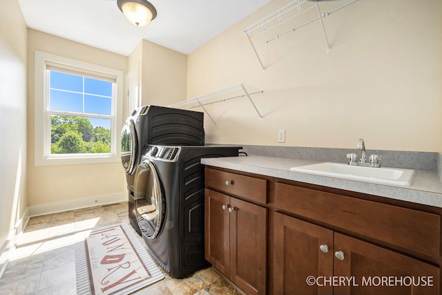 7511 Emerald Woods SE, Byron Center, MI 49315 - laundry room featuring washing machine and clothes dryer and cabinet space