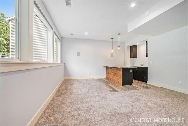 7511 Emerald Woods SE, Byron Center, MI 49315 - bar with light carpet, recessed lighting, and decorative light fixtures