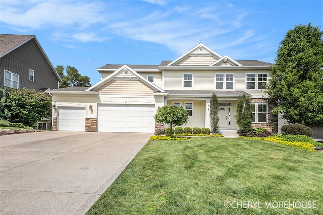 7511 Emerald Woods SE, Byron Center, MI 49315 - view of front of home featuring stone siding, an attached garage, a front lawn, concrete driveway, and a shingled roof