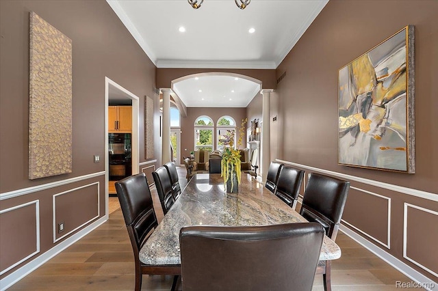 6280 Branford Dr, West Bloomfield, MI 48322 - dining space with decorative columns, ornamental molding, wood finished floors, recessed lighting, and arched walkways