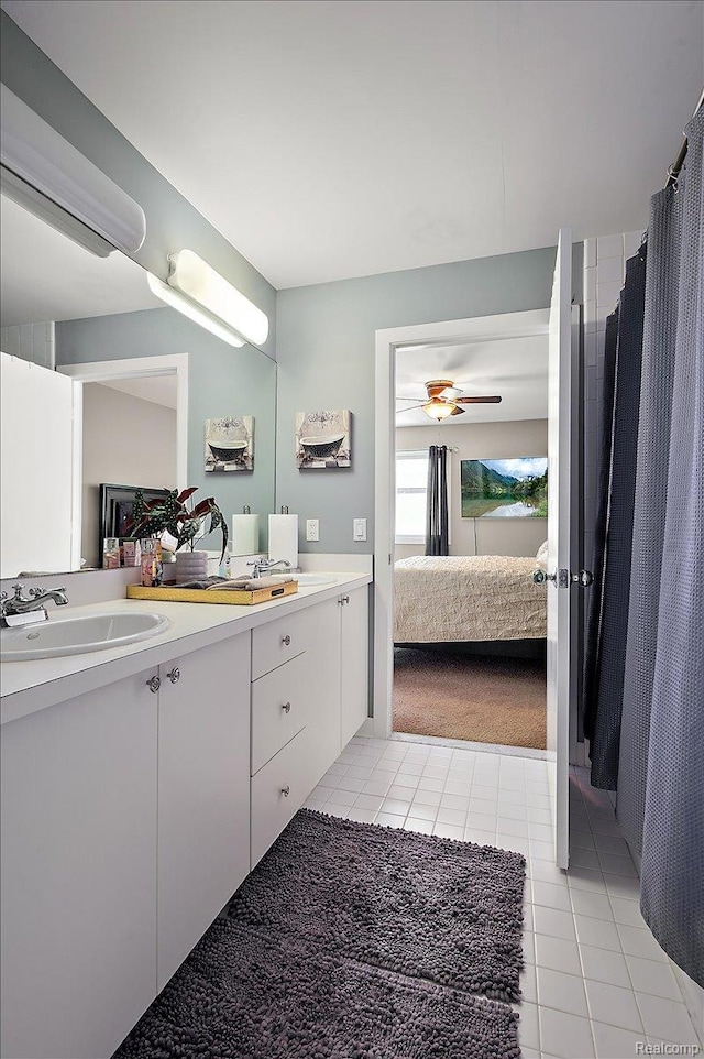 6280 Branford Dr, West Bloomfield, MI 48322 - bathroom featuring connected bathroom, tile patterned floors, double vanity, and a ceiling fan