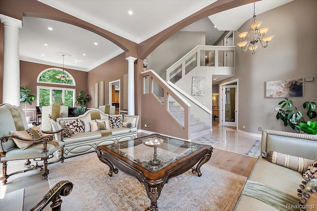 6280 Branford Dr, West Bloomfield, MI 48322 - living area with ornate columns, arched walkways, recessed lighting, a chandelier, and stairway