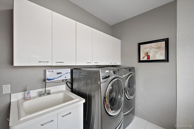 6280 Branford Dr, West Bloomfield, MI 48322 - washroom featuring cabinet space, washer and dryer, and tile patterned flooring