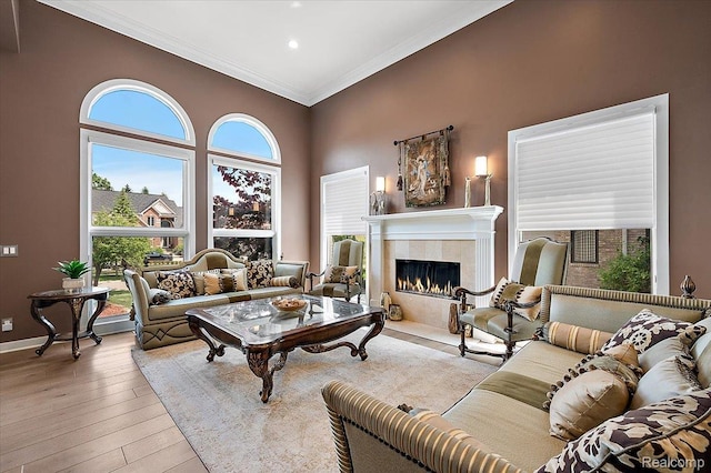6280 Branford Dr, West Bloomfield, MI 48322 - living area with a tiled fireplace, crown molding, hardwood / wood-style floors, and recessed lighting