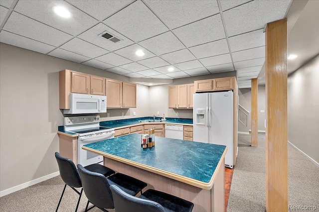 6280 Branford Dr, West Bloomfield, MI 48322 - kitchen featuring white appliances, light brown cabinets, light carpet, recessed lighting, and a breakfast bar area