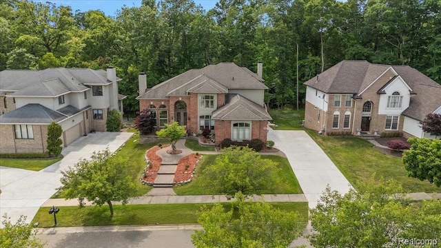 6280 Branford Dr, West Bloomfield, MI 48322 - view of front of house with driveway, brick siding, a chimney, a front yard, and a garage