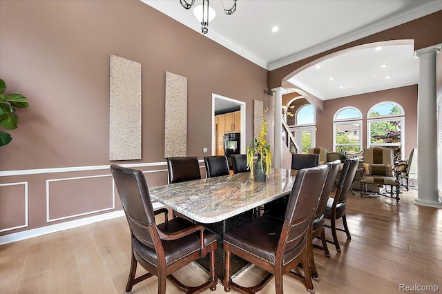 6280 Branford Dr, West Bloomfield, MI 48322 - dining space with decorative columns, arched walkways, ornamental molding, hardwood / wood-style flooring, and recessed lighting