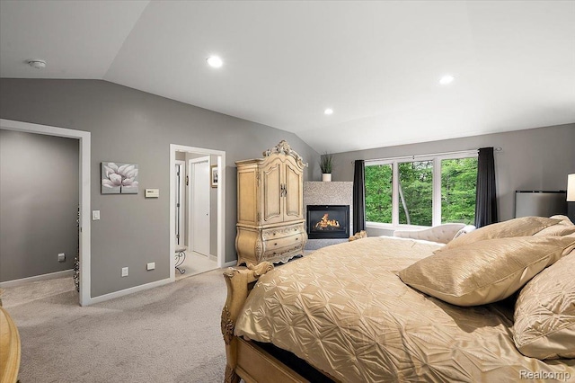 6280 Branford Dr, West Bloomfield, MI 48322 - bedroom featuring lofted ceiling, a glass covered fireplace, light colored carpet, and recessed lighting