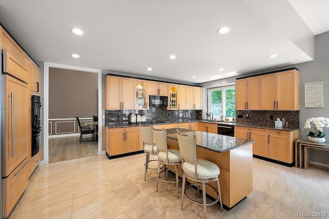 6280 Branford Dr, West Bloomfield, MI 48322 - kitchen featuring black appliances, backsplash, a kitchen breakfast bar, recessed lighting, and a kitchen island