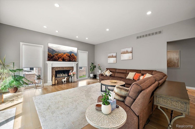 6280 Branford Dr, West Bloomfield, MI 48322 - living room featuring recessed lighting, wood finished floors, and a high end fireplace
