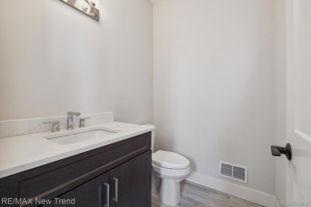 2921 Walsh Dr, Rochester Hills, MI 48309 - half bathroom featuring toilet and vanity