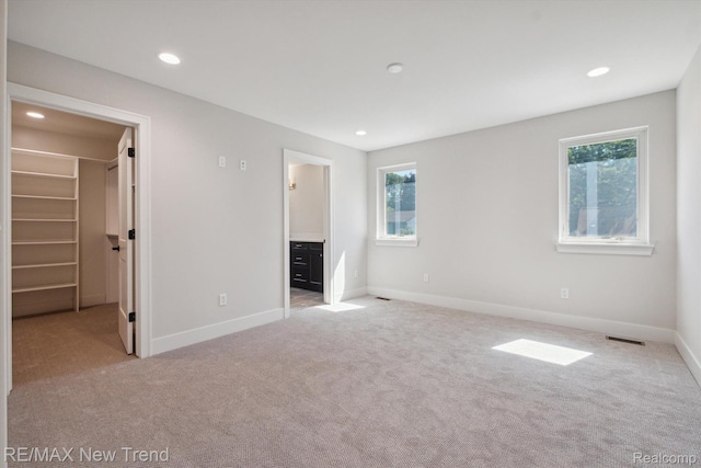 2921 Walsh Dr, Rochester Hills, MI 48309 - unfurnished bedroom featuring carpet, a spacious closet, recessed lighting, and connected bathroom