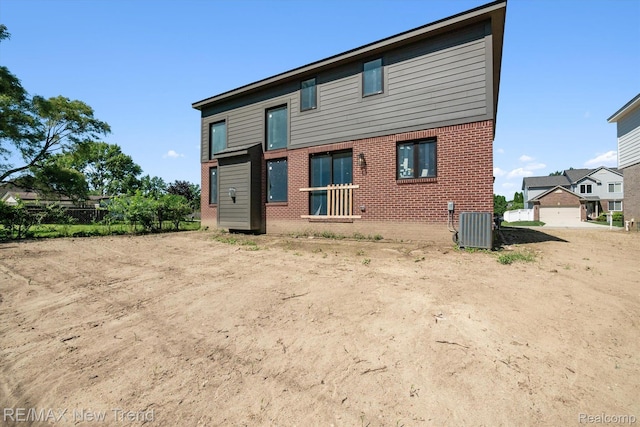 2921 Walsh Dr, Rochester Hills, MI 48309 - back of house featuring brick siding
