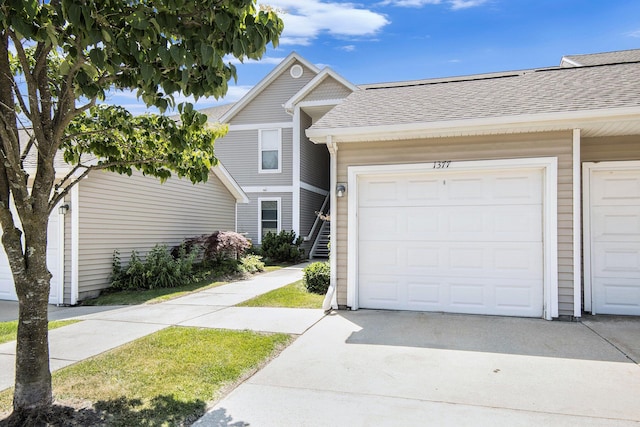 1377 Fox Pointe Cir, Ann Arbor, MI 48108 - view of front of home with roof with shingles and driveway