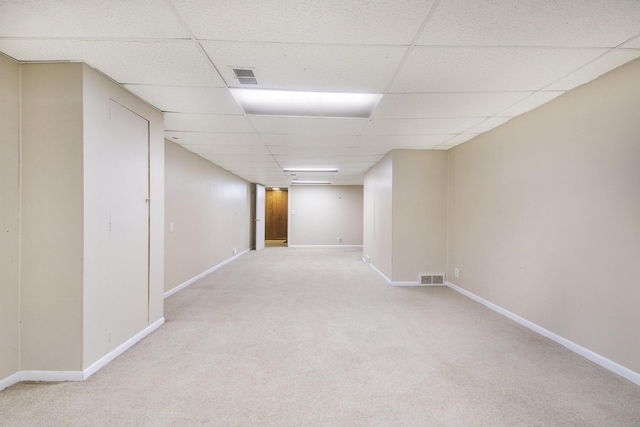 1915 Orville St SE, Grand Rapids, MI 49506 - finished below grade area with a paneled ceiling and light colored carpet