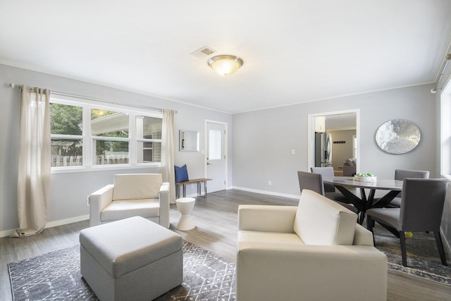 1915 Orville St SE, Grand Rapids, MI 49506 - living area featuring crown molding and wood finished floors