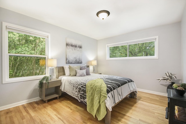 1915 Orville St SE, Grand Rapids, MI 49506 - bedroom with multiple windows and wood finished floors