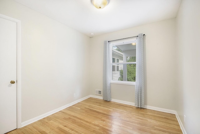 1915 Orville St SE, Grand Rapids, MI 49506 - spare room featuring light wood-style floors and baseboards