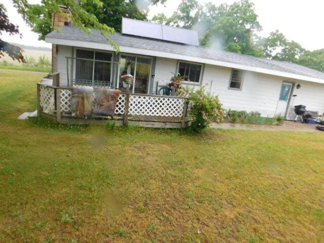 3509 E Taylor Rd, Hart, MI 49420 - rear view of house with a yard