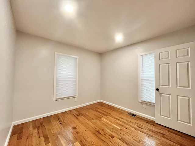 336 E Prospect St, Jackson, MI 49203 - spare room featuring baseboards and light wood-type flooring