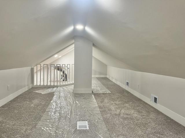 336 E Prospect St, Jackson, MI 49203 - additional living space with lofted ceiling and carpet floors