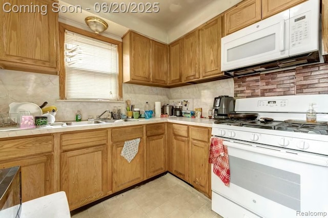 13980 Prevost St, Redford, MI 48227 - kitchen featuring white appliances, backsplash, tile counters, and brown cabinets
