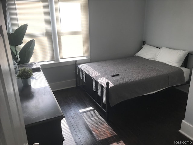 18522 Joseph Campau St, Detroit, MI 48234 - bedroom with dark wood-style floors and baseboards