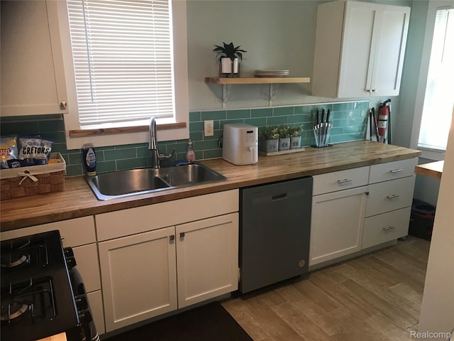 18522 Joseph Campau St, Detroit, MI 48234 - kitchen with wood counters, dishwasher, and range
