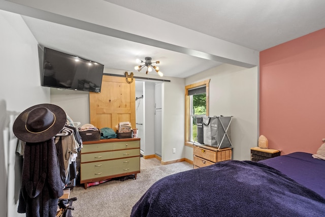 10456 Ferris Ave, Grant, MI 49327 - bedroom featuring light colored carpet and a barn door