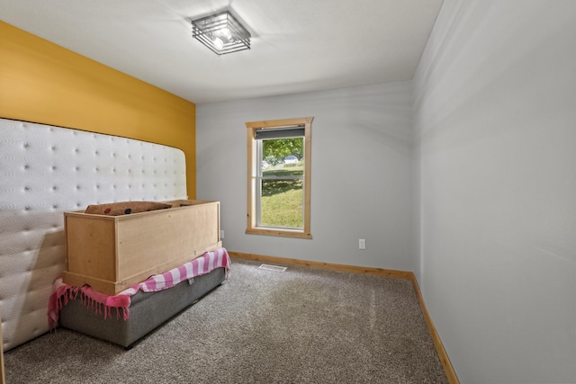 10456 Ferris Ave, Grant, MI 49327 - bedroom with baseboards and carpet flooring