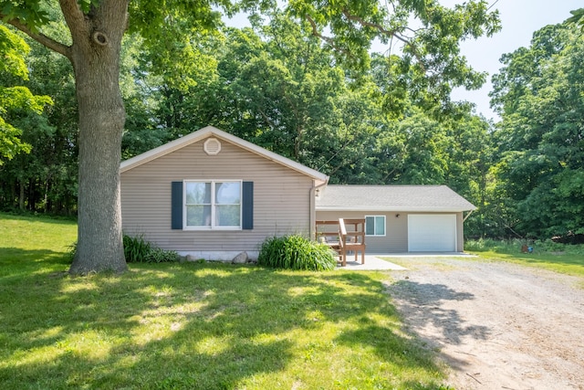 10456 Ferris Ave, Grant, MI 49327 - single story home with driveway, a front lawn, and an attached garage