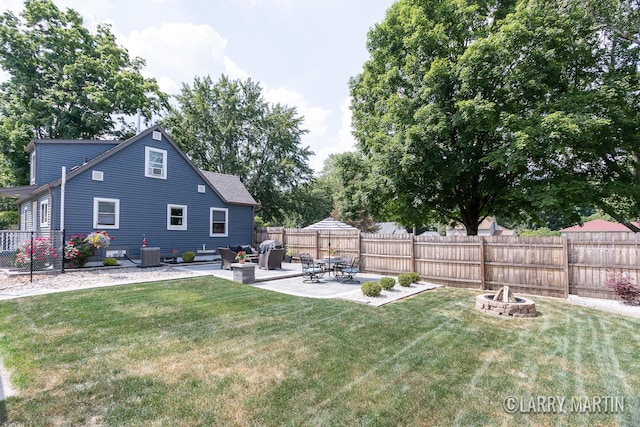 1426 Lancashire SE, Grand Rapids, MI 49508 - fenced backyard featuring a patio area and an outdoor fire pit
