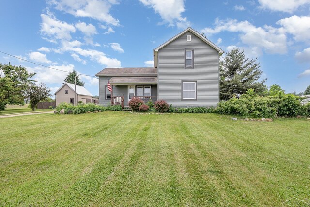 8603 Millington Rd, Vassar, MI 48768 - view of front of house featuring a front yard and a porch
